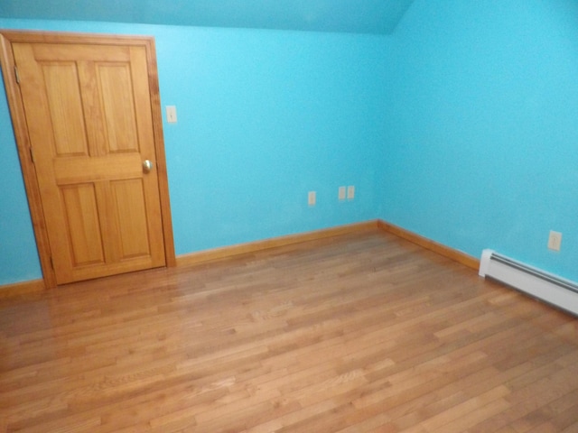 953 Pushaw Rd, Glenburn, ME 04401 - spare room with light wood-style floors and a baseboard heating unit