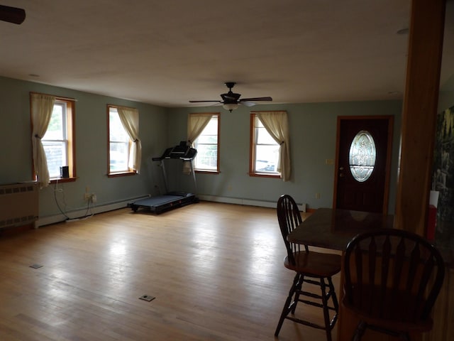 953 Pushaw Rd, Glenburn, ME 04401 - unfurnished dining area with radiator heating unit, ceiling fan, wood finished floors, and baseboard heating
