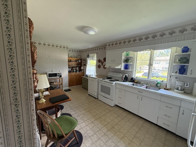 29 Birchwood Blvd, Brewer, ME 04412 - kitchen featuring white appliances, open shelves, light flooring, wallpapered walls, and white cabinets