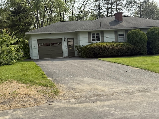 29 Birchwood Blvd, Brewer, ME 04412 - ranch-style house with driveway, an attached garage, a chimney, a front yard, and a shingled roof