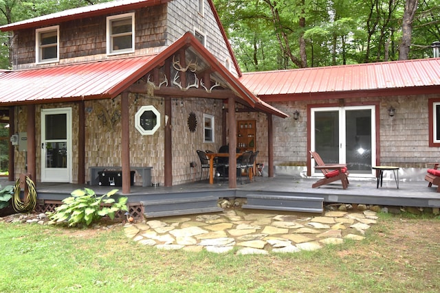 108 Maple Rd, Atkinson, ME 04426 - rear view of property with a metal roof and a deck