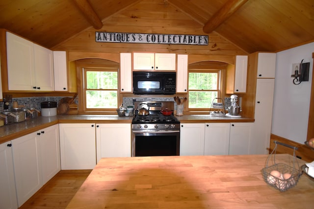 108 Maple Rd, Atkinson, ME 04426 - kitchen featuring black microwave, stainless steel gas range, wooden counters, wood finished floors, and arched walkways
