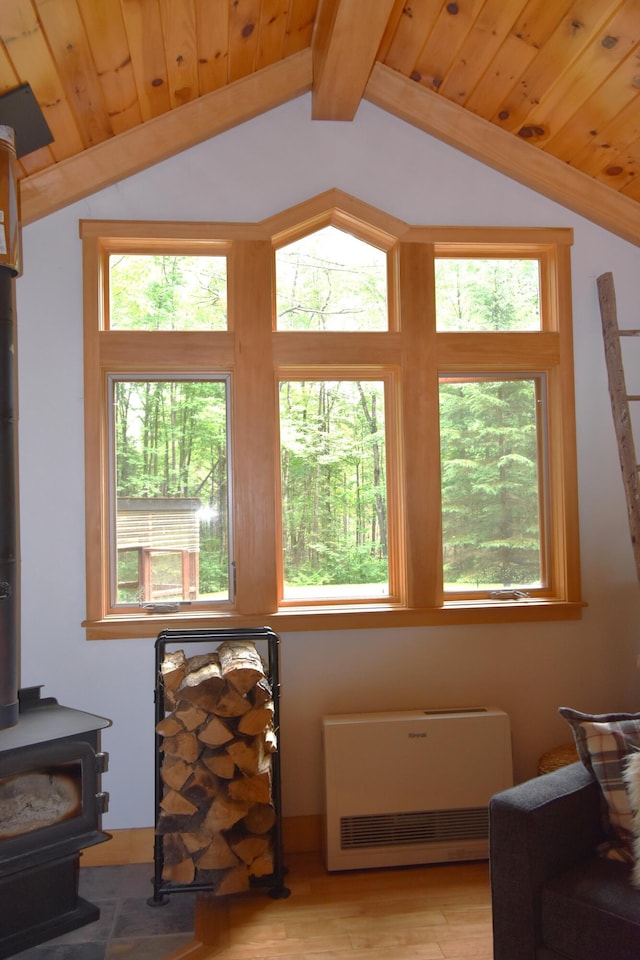 108 Maple Rd, Atkinson, ME 04426 - sitting room featuring vaulted ceiling, wooden ceiling, a wood stove, light wood finished floors, and heating unit