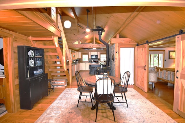 108 Maple Rd, Atkinson, ME 04426 - dining area with light wood-type flooring, wooden ceiling, and wooden walls