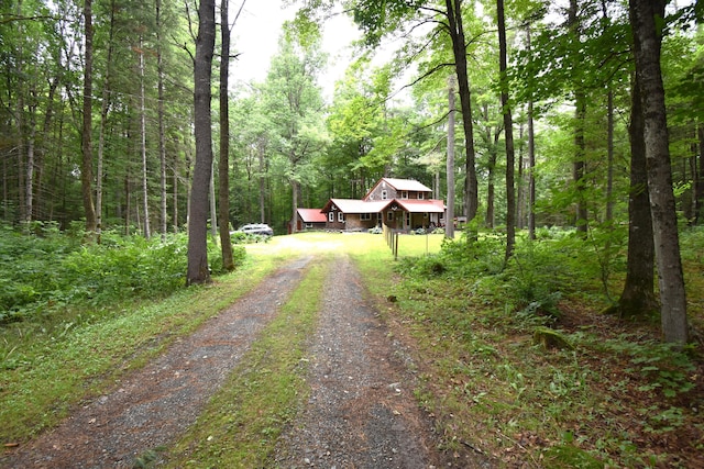 108 Maple Rd, Atkinson, ME 04426 - view of dirt / gravel driveway with a wooded view