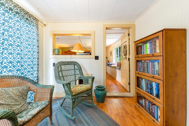 131 River Rd, Newcastle, ME 04553 - sitting room featuring crown molding, wood finished floors, and wallpapered walls