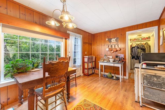 131 River Rd, Newcastle, ME 04553 - dining room featuring wood walls and light wood-style flooring
