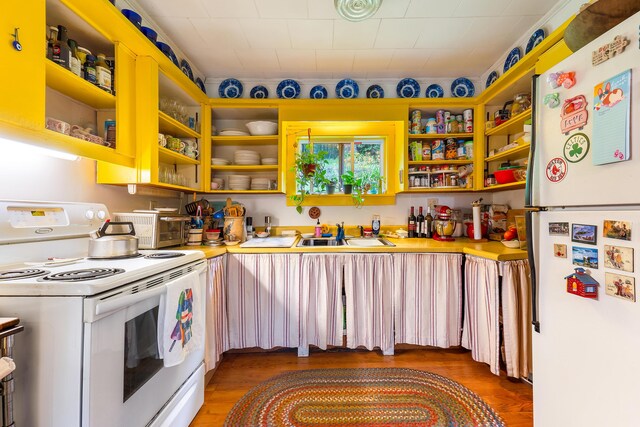 131 River Rd, Newcastle, ME 04553 - kitchen with white appliances, open shelves, light wood-style flooring, and light countertops