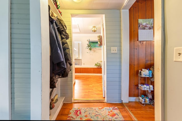 131 River Rd, Newcastle, ME 04553 - corridor featuring light wood finished floors and wooden walls
