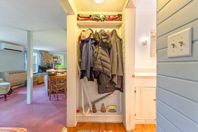 131 River Rd, Newcastle, ME 04553 - closet with a wall mounted AC and radiator heating unit