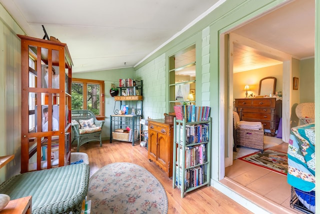 131 River Rd, Newcastle, ME 04553 - living area featuring wood finished floors, lofted ceiling, and ornamental molding