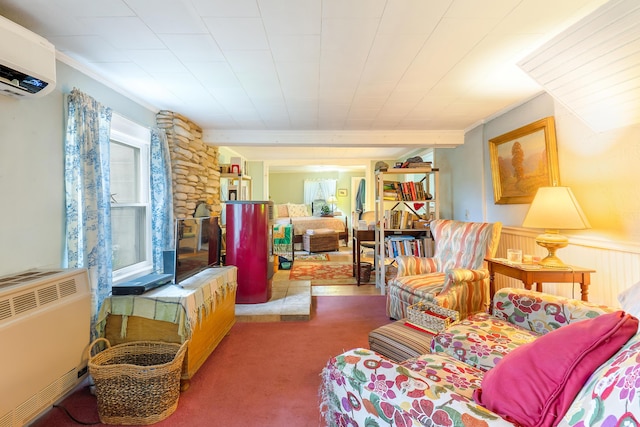 131 River Rd, Newcastle, ME 04553 - carpeted living area featuring a wall unit AC, ornamental molding, radiator, and a wainscoted wall