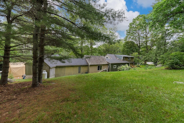 131 River Rd, Newcastle, ME 04553 - rear view of property with roof with shingles and a garage