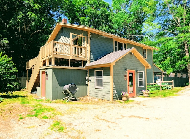 120 Sunday River Rd, Bethel, ME 04217 - view of front of property with a chimney, stairway, a wooden deck, and roof with shingles