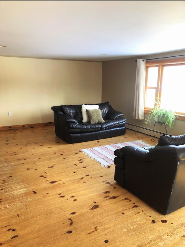 120 Sunday River Rd, Bethel, ME 04217 - living area featuring wood finished floors and baseboard heating