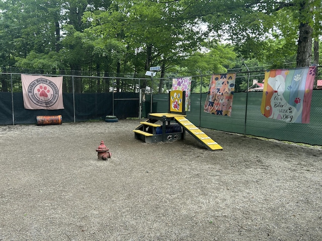 120 Sunday River Rd, Bethel, ME 04217 - view of playground featuring a dog friendly area and view of wooded area