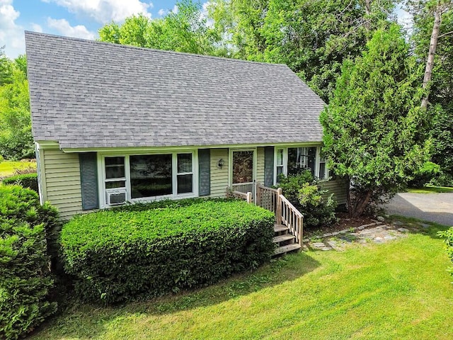 77 W River Rd, Waterville, ME 04901 - cape cod-style house with roof with shingles, a front yard, and cooling unit