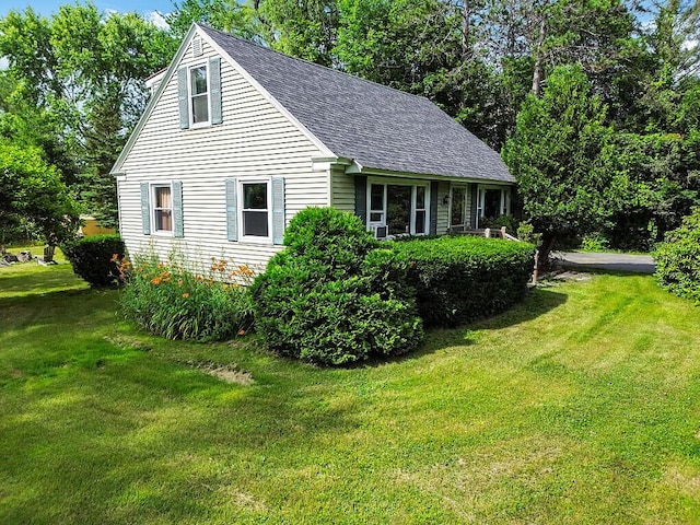 77 W River Rd, Waterville, ME 04901 - view of side of property featuring a yard and a shingled roof