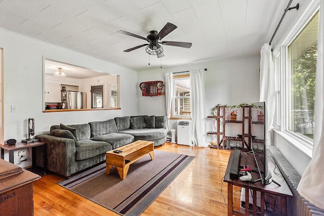 77 W River Rd, Waterville, ME 04901 - living room featuring light wood finished floors and a ceiling fan