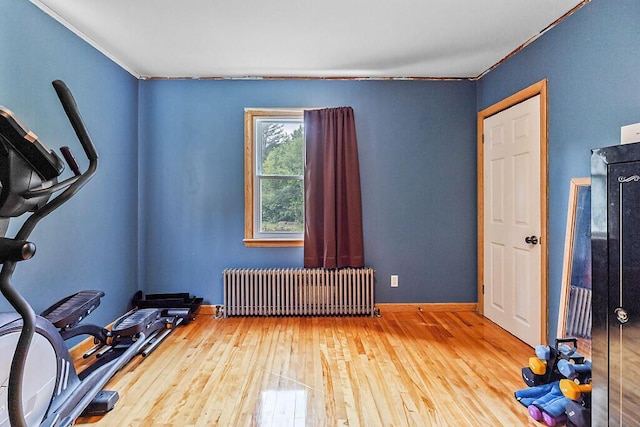 77 W River Rd, Waterville, ME 04901 - workout room featuring radiator, wood-type flooring, and crown molding