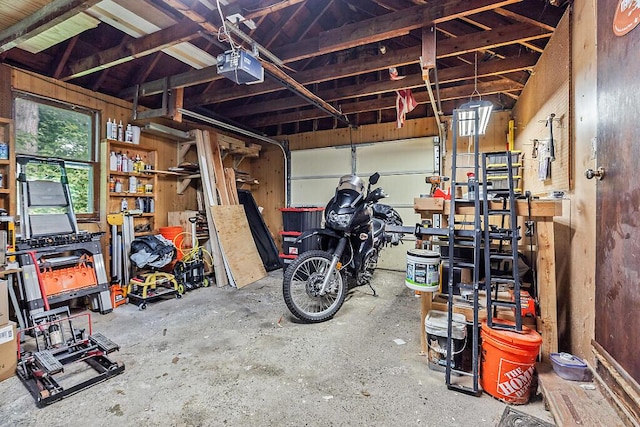 77 W River Rd, Waterville, ME 04901 - garage with a garage door opener and a workshop area
