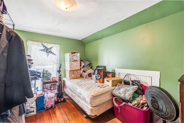 131 Pleasant St, Dexter, ME 04930 - bedroom with wood finished floors and lofted ceiling