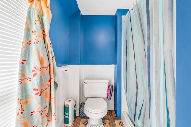 131 Pleasant St, Dexter, ME 04930 - bathroom featuring a wainscoted wall and curtained shower
