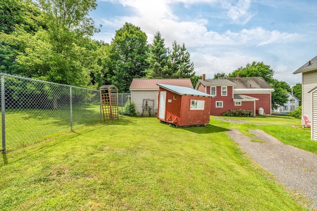 131 Pleasant St, Dexter, ME 04930 - view of yard featuring a storage unit and driveway