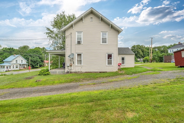 131 Pleasant St, Dexter, ME 04930 - view of property exterior with a yard, a carport, crawl space, and driveway