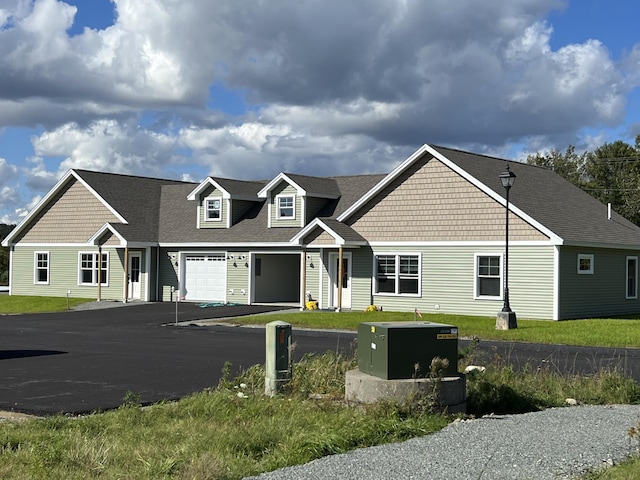 43 Tinker Meadow Way Unit 19, Ellsworth, ME 04605 - view of front facade featuring asphalt driveway, a garage, and roof with shingles