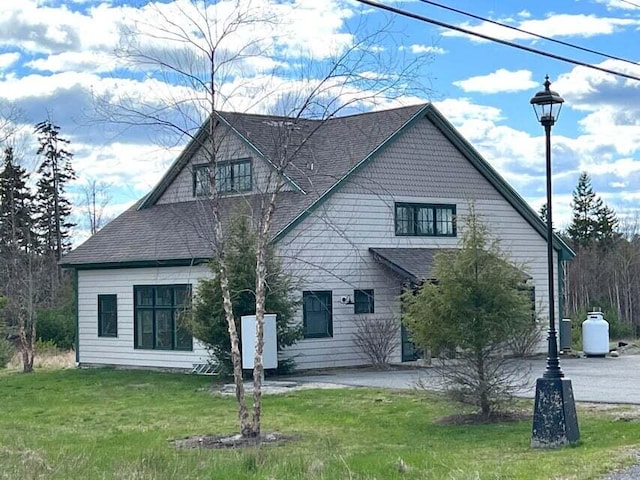 43 Tinker Meadow Way Unit 19, Ellsworth, ME 04605 - view of front facade with a shingled roof and a front lawn