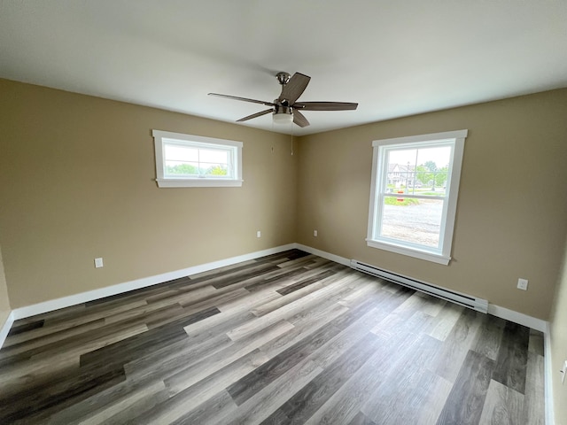 43 Tinker Meadow Way Unit 19, Ellsworth, ME 04605 - spare room with a baseboard heating unit, ceiling fan, and wood finished floors