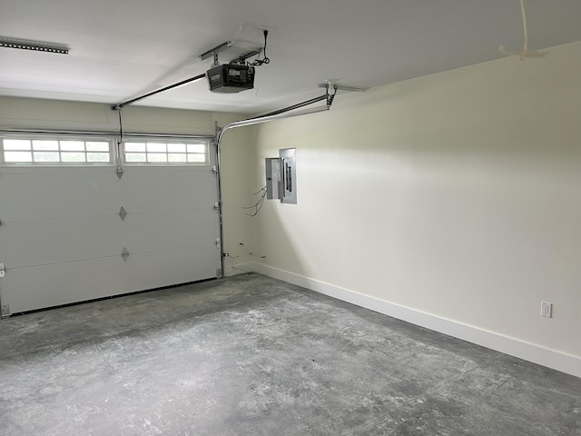 43 Tinker Meadow Way Unit 19, Ellsworth, ME 04605 - garage with a garage door opener and electric panel