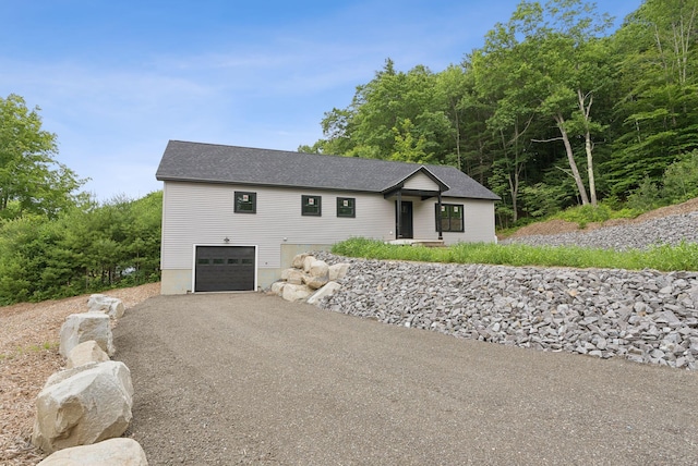 127 Bond Brook Rd, Augusta, ME 04330 - view of front facade with a garage, driveway, and a shingled roof