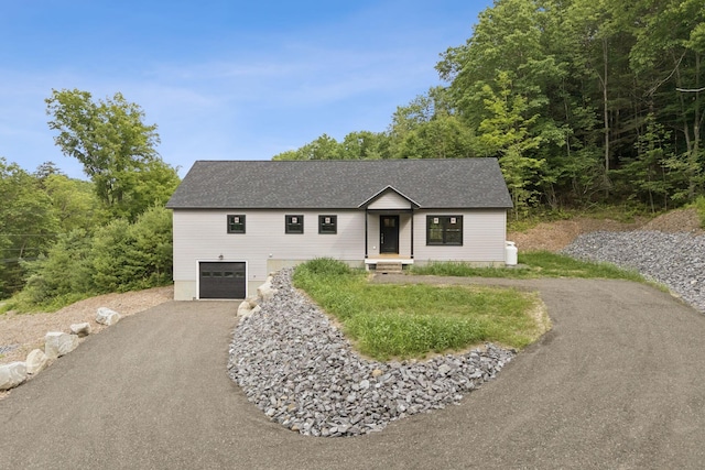 127 Bond Brook Rd, Augusta, ME 04330 - single story home with driveway, an attached garage, and roof with shingles