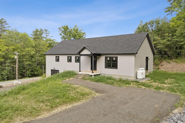 127 Bond Brook Rd, Augusta, ME 04330 - view of front of home featuring driveway, a shingled roof, and a garage
