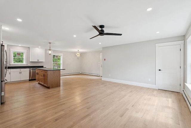 127 Bond Brook Rd, Augusta, ME 04330 - kitchen featuring recessed lighting, dark countertops, appliances with stainless steel finishes, ceiling fan, and a center island