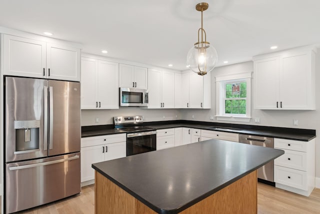 127 Bond Brook Rd, Augusta, ME 04330 - kitchen featuring appliances with stainless steel finishes, dark countertops, light wood finished floors, and recessed lighting