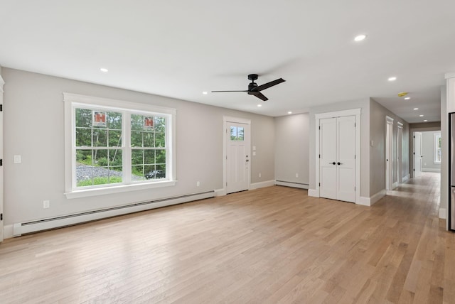127 Bond Brook Rd, Augusta, ME 04330 - unfurnished living room featuring baseboard heating, ceiling fan, light wood-style floors, recessed lighting, and a baseboard radiator
