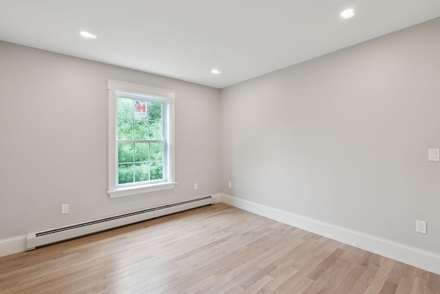 127 Bond Brook Rd, Augusta, ME 04330 - empty room with a baseboard heating unit, light wood finished floors, and recessed lighting