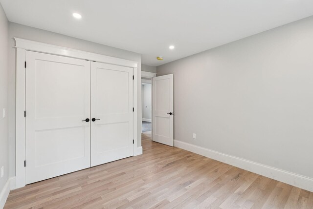 127 Bond Brook Rd, Augusta, ME 04330 - unfurnished bedroom with light wood-type flooring, recessed lighting, and a closet