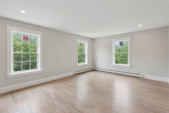 127 Bond Brook Rd, Augusta, ME 04330 - unfurnished room with a baseboard heating unit, healthy amount of natural light, light wood-type flooring, and recessed lighting