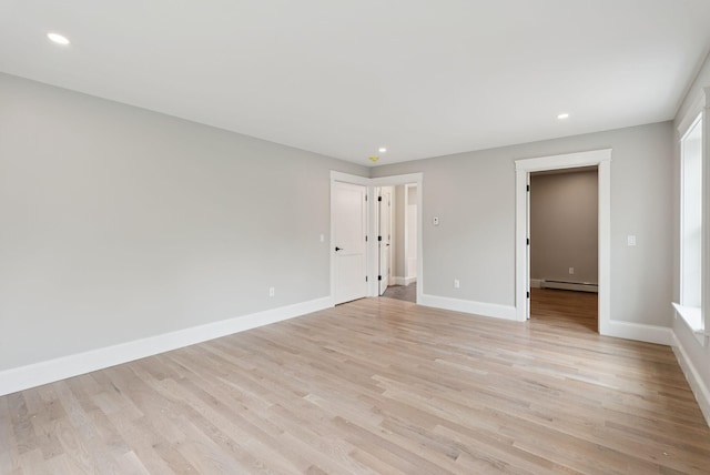 127 Bond Brook Rd, Augusta, ME 04330 - unfurnished room with a baseboard heating unit, light wood-style floors, and recessed lighting