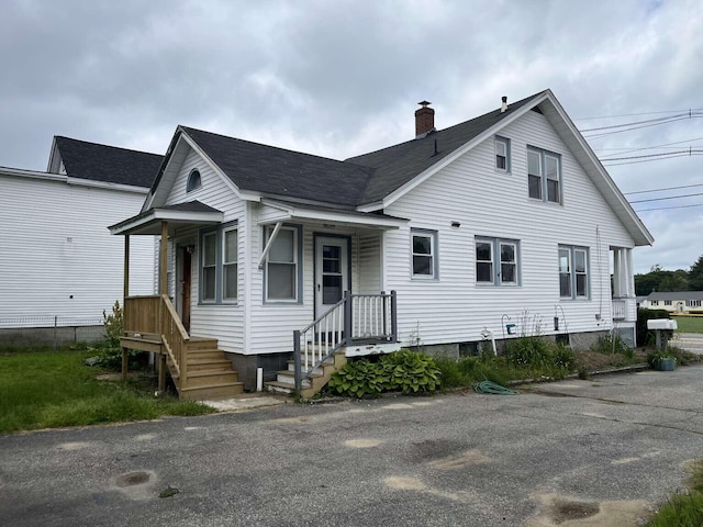 107 May St, Biddeford, ME 04005 - view of front of home featuring a chimney and a shingled roof