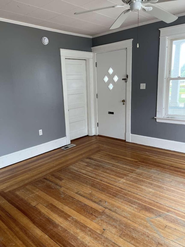 107 May St, Biddeford, ME 04005 - entrance foyer with a ceiling fan, wood finished floors, and crown molding