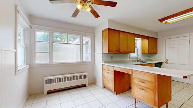 69 Androscoggin Ave, Lewiston, ME 04240 - kitchen featuring radiator heating unit, light countertops, healthy amount of natural light, and a ceiling fan