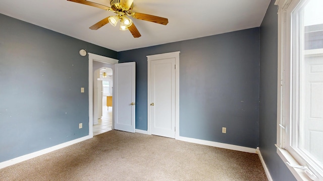 69 Androscoggin Ave, Lewiston, ME 04240 - unfurnished bedroom with carpet and ceiling fan