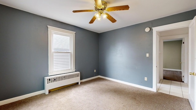 69 Androscoggin Ave, Lewiston, ME 04240 - carpeted empty room featuring radiator heating unit, a ceiling fan, and a smoke detector