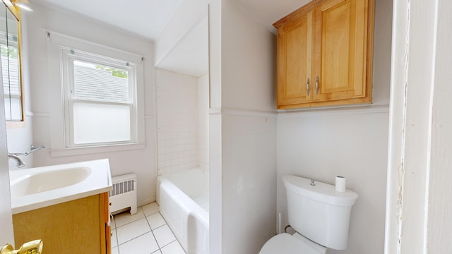 69 Androscoggin Ave, Lewiston, ME 04240 - full bathroom featuring radiator heating unit, vanity, a tub, and tile patterned flooring