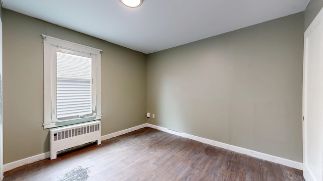 69 Androscoggin Ave, Lewiston, ME 04240 - empty room featuring radiator and dark wood-style floors